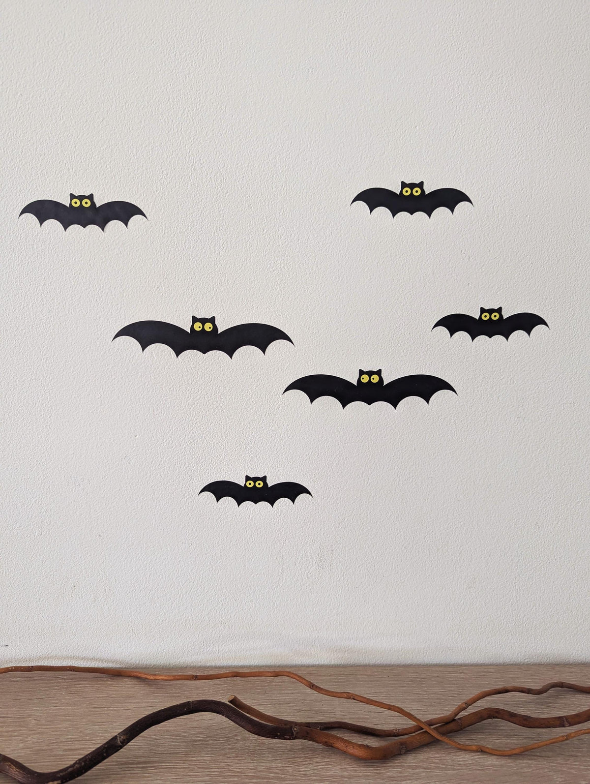 Cute bat wall decals with yellow eyes on a wall