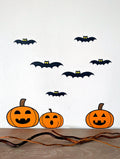Pumpkin and bat wall decals on a wall