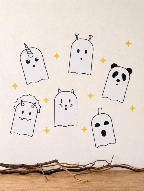 Six cute ghost wall decals on a cream wall
